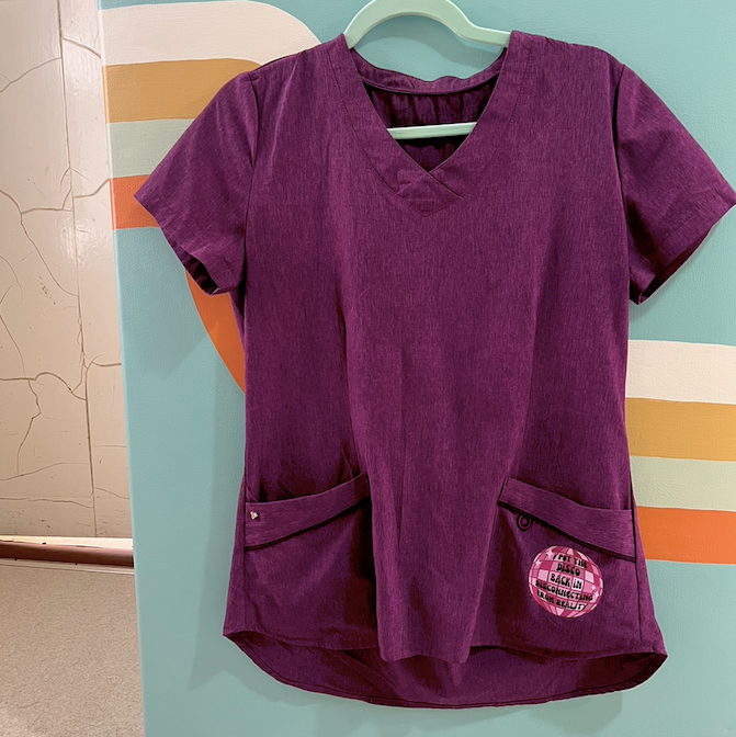 "disconnecting from reality" purple scrub top (size XS/S)