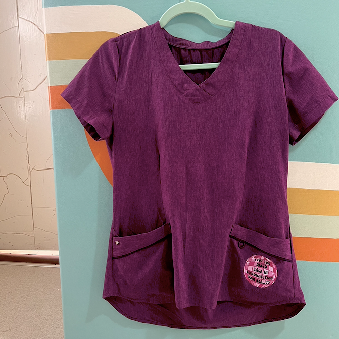 "disconnecting from reality" purple scrub top (size XS/S)