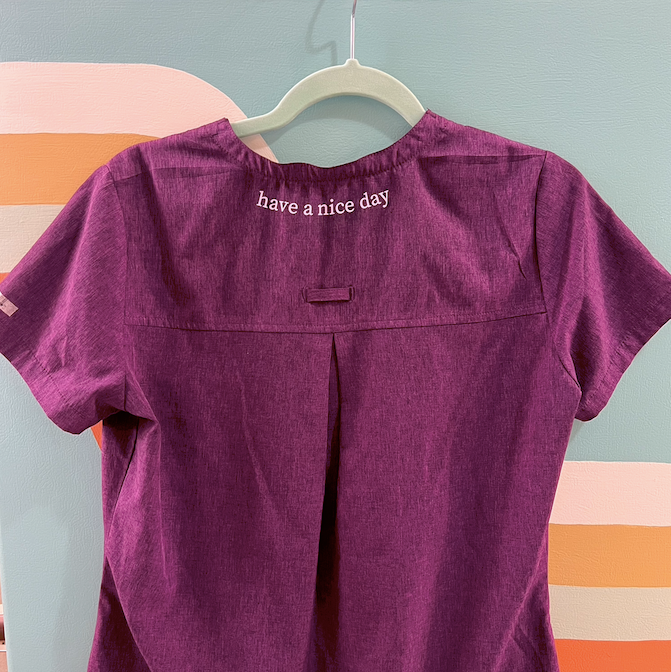 "disconnecting from reality" purple scrub top (size XS/S)